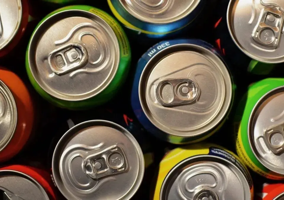 Close up of metal beer cans in row